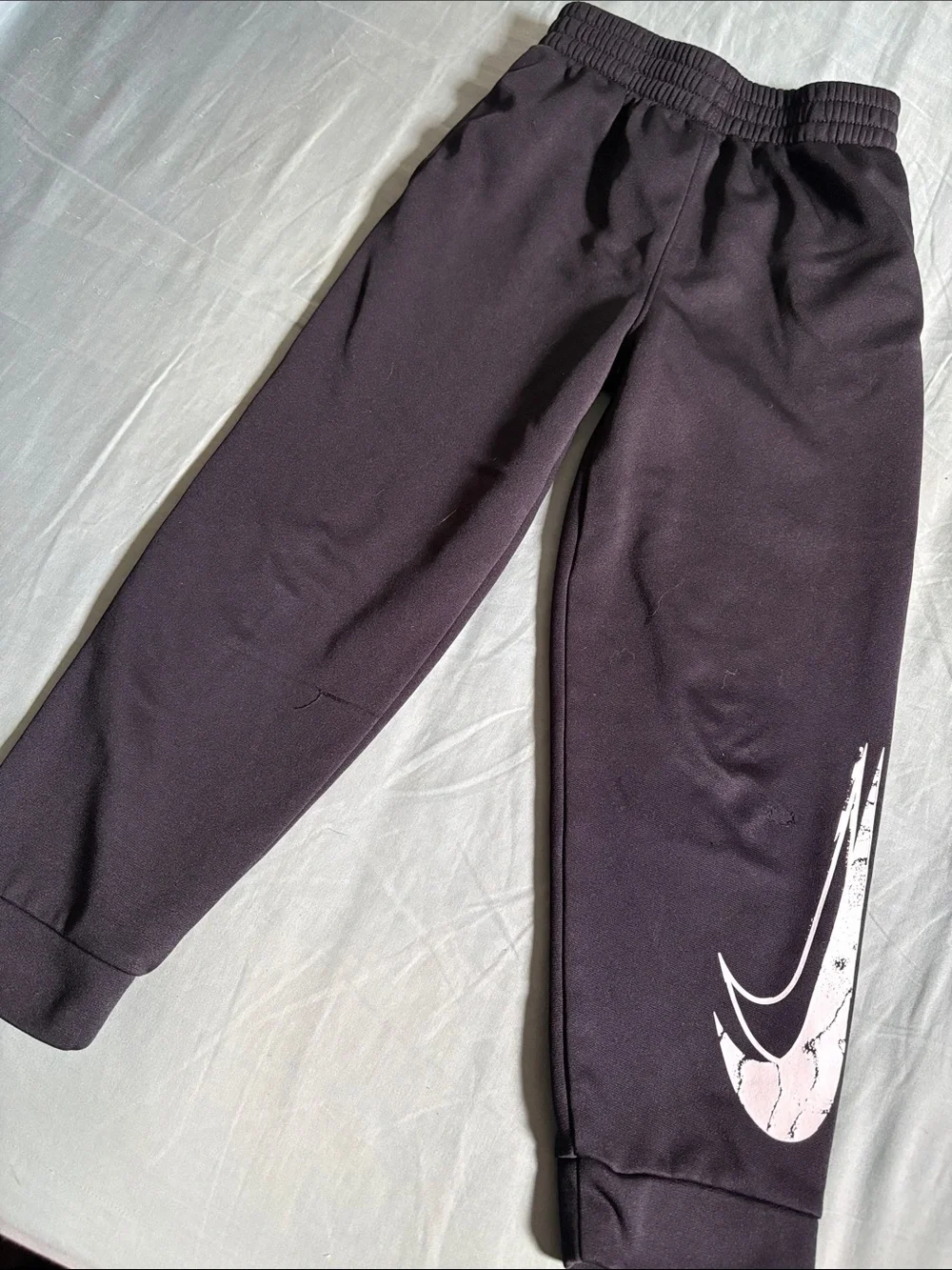 Nike Kids Black Joggers with White Swoosh Graphic